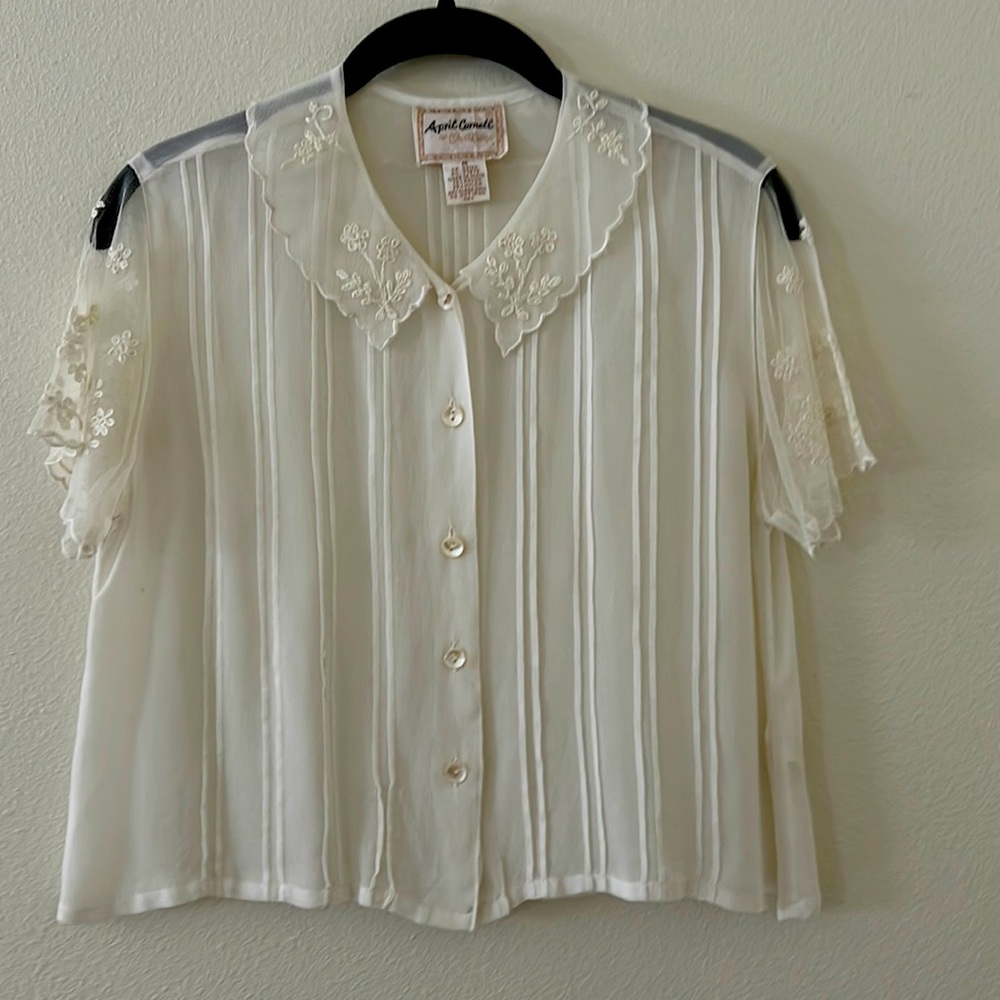 April Cornell short-sleeve blouse, rayon chiffon with pin tucks and embroidery.